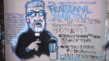 graffiti on wall of man with death toll of fentanyl written next to him