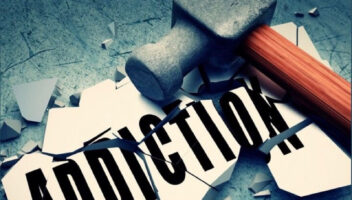 the word addiction smashed by hammer