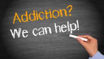 grey background with wording saying 'addiction? we can help'